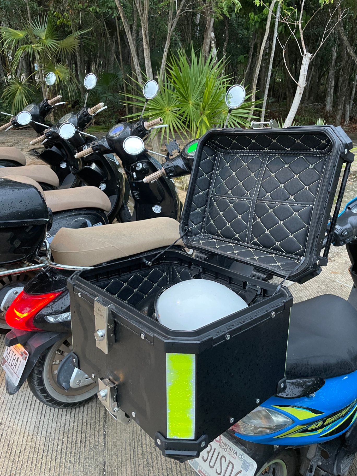 Lockable storage box open with helmet inside